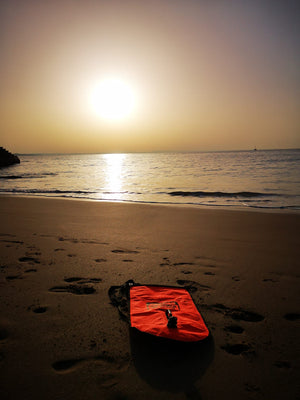 Swimbuoy on beach winter sun rise Cascais